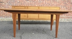 Walnut dining table by Alfred Cox