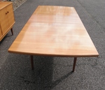 Walnut dining table by Alfred Cox